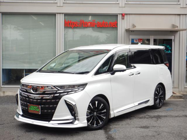 現行型6年式　アルファードハイブリッド25エグゼクティブラウンジ　14インチディスプレイナビTV　ＪＢＬプレミアムサウンドシステム　パノラミックビューモニター　14インチリヤシートエンターテインメントシステム　本革エグゼクティブラウンジパワーシート　左右独立ムーンルーフ　トヨタチームメイト　ユニバーサルステップ　カラーヘッドアップディスプレイ　デジタルインナーミラー　ブラインドスポットモニター　モデリスタエアロバージョン&マフラー　両側パワースライドドア　パワーバックドア　シグネチャーイルミブレード